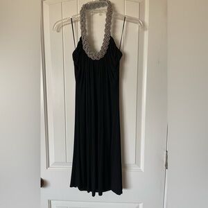 Black halter sleeveless knee-length dress.
